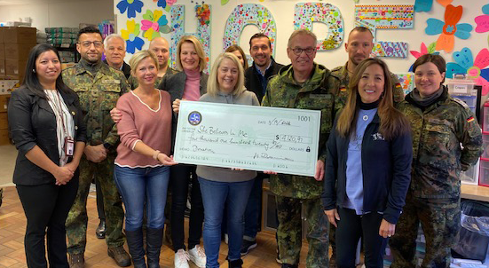 photo of SBIM leadership receiving a generous donation from the German Armed Forces Command